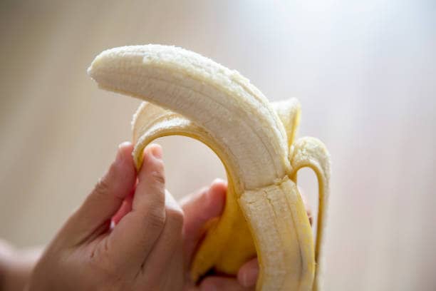 hand peeling banana